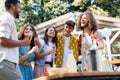 Friends and family talking and having fun at a summer grill garden party. Royalty Free Stock Photo