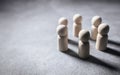 Friends, family, team or community, wooden people meeting in a circle background