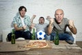 Friends fanatic football fans watching game on tv celebrating goal screaming crazy happy