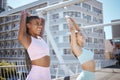 Friends, fitness and training together in the city on summer day. Workout, stretching and two young women exercising Royalty Free Stock Photo