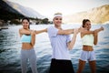 Friends fitness training together outdoors living active healthy Royalty Free Stock Photo