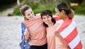 Friends, flag and usa with girls on the beach together during summer day for bonding in nature. Team, patriot and Royalty Free Stock Photo