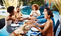 Friends, food table and eating outdoor for social gathering, happiness and holiday celebration. Diversity, men and women Royalty Free Stock Photo