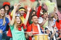 Friends football supporter fans watching soccer match event at stadium - Young people having fun supporting club Royalty Free Stock Photo