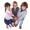 Friends forever. Three friends standing with their hands piled up and looking at the camera. Royalty Free Stock Photo