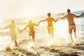 Friends fun beach susnet run Royalty Free Stock Photo