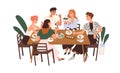 Friends gathering at dining table with wine and food. Happy young people eating, celebrating holiday, talking, relaxing