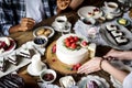 Friends Gathering Together on Tea Party Eating Cakes Enjoyment h Royalty Free Stock Photo