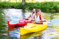 Friends going down river in sport canoe Royalty Free Stock Photo