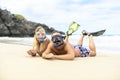 Couple lay on the beach is going to swim and snorkle on hawaii beach Royalty Free Stock Photo