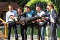 Groom portraying superhero flying to bride