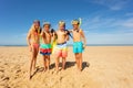 Friends group on the beach with snorkeling tools