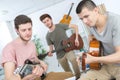 Friends with guitar playing Royalty Free Stock Photo