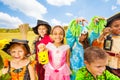 Friends in Halloween costumes stand close Royalty Free Stock Photo