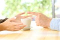 Friends hands arguing in a restaurant or home Royalty Free Stock Photo