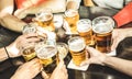 Friends hands drinking beer at brewery pub restaurant - Friendship concept with young people enjoying time together and having ge Royalty Free Stock Photo