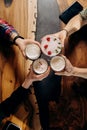 Friends hands toasting and having fun together drinking beer and cocktails in pub restaurant Royalty Free Stock Photo