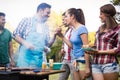 Friends having a barbecue party in nature Royalty Free Stock Photo