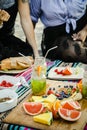 Friends having a beach party with snacks