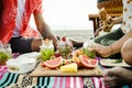 Friends having a beach picnic