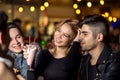 Friends having a coffee together. women and man at cafe, talking, laughing Royalty Free Stock Photo