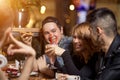 Friends having a coffee together. women and man at cafe, talking, laughing Royalty Free Stock Photo