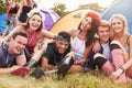 Friends having fun on the campsite at a music festival