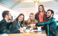 Friends having fun at coffee bar - Young people talking and sharing time together at university lounge area - Friendship concept Royalty Free Stock Photo