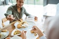 friends having fun eating lunch together at home with traditional food Royalty Free Stock Photo