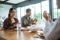 friends having fun eating lunch together at home with traditional food Royalty Free Stock Photo