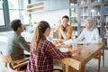 friends having fun eating lunch together at home with traditional food Royalty Free Stock Photo