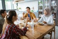 friends having fun eating lunch together at home with traditional food Royalty Free Stock Photo