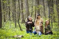 Friends having fun in the forest