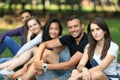 Friends having fun on open air. Focus on young woman Royalty Free Stock Photo