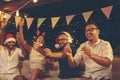 Friends having fun with sparklers at New Year party Royalty Free Stock Photo