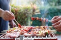 Friends having party and cooking barbecue in gardern Royalty Free Stock Photo