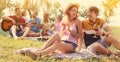 Friends having picnic in park on sunny day Royalty Free Stock Photo