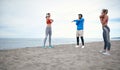 Friends having a training on the beach Royalty Free Stock Photo