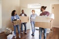 Friends Help Couple To Carry Boxes Into New Home On Moving Day Royalty Free Stock Photo