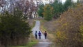 Friends hiking in the forest footpath with social distancing