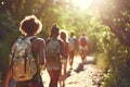 Friends on hiking route traveling together fun activity mountains nature sports healthy lifestyle summer travel carrying Royalty Free Stock Photo