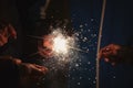 Friends holding beautiful sparklers in celebration of the new year