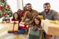 Friends holding Christmas presents Royalty Free Stock Photo