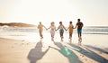 Friends, holding hands and running at sunset on beach in summer or walking together on holiday in California with Royalty Free Stock Photo