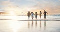 Friends, holding hands and running to water on beach, sunset or vacation, holiday and summer break with freedom. Group Royalty Free Stock Photo