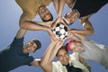 Friends Holding Soccer Ball Together In Huddle Royalty Free Stock Photo