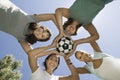 Friends Holding Soccer Ball Together In Huddle Royalty Free Stock Photo