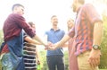 Friends join hand together during at barbecue in nature. Royalty Free Stock Photo