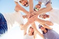 Friends joining hands while standing huddle, down view photo Royalty Free Stock Photo