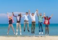 Friends jumping on the beach Royalty Free Stock Photo